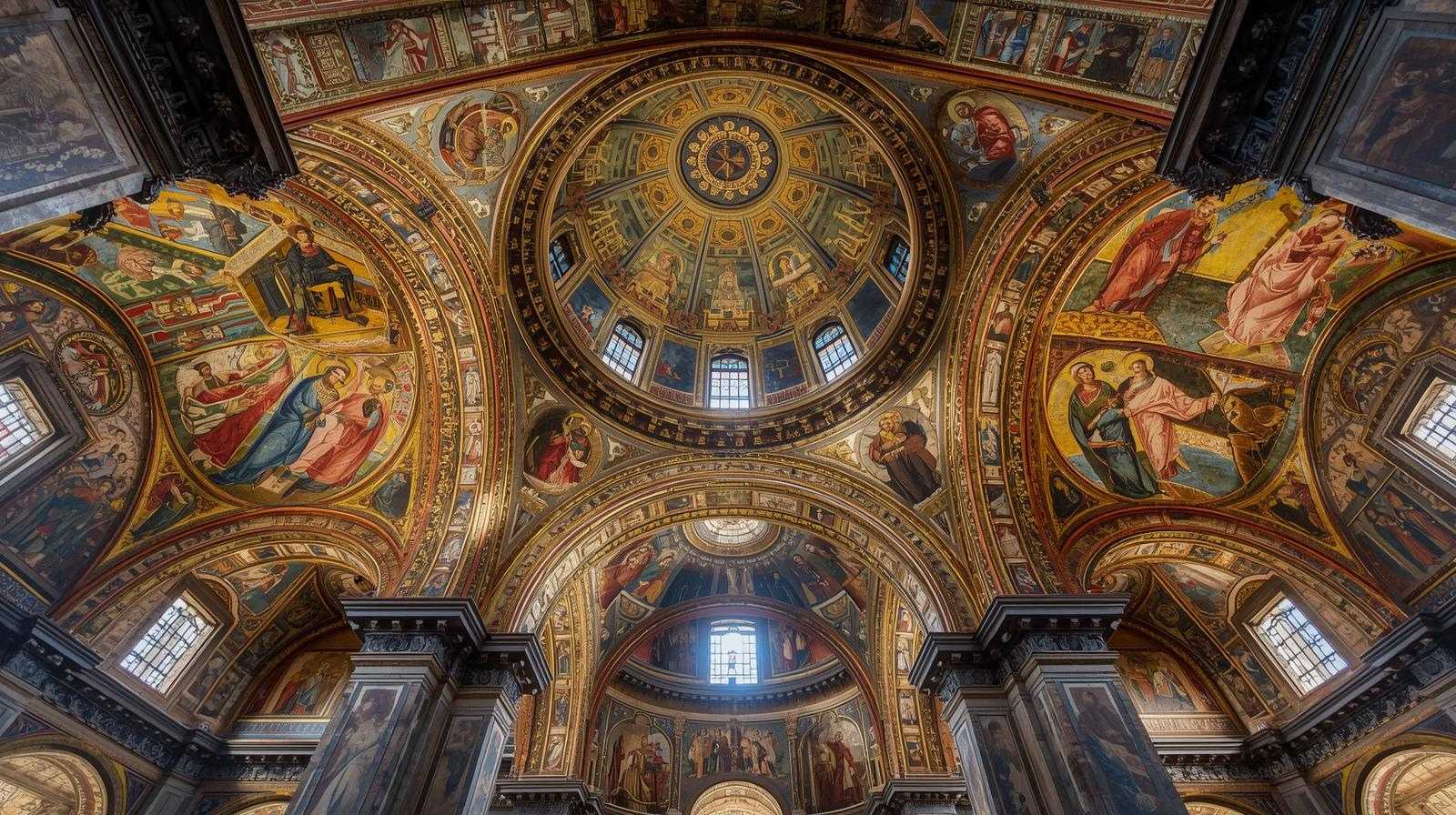 A ceiling of a building with paintings on the ceiling

AI-generated content may be incorrect.